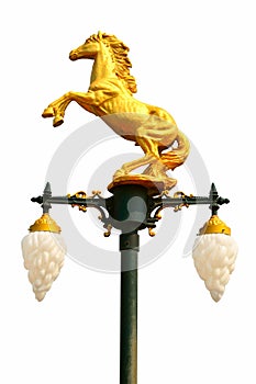 Lamp with a horse sculpture on white background.