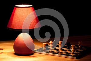 Lamp illuminating chess-board