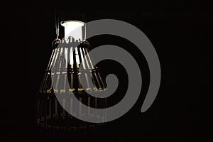 A lamp with lampshades of bamboo cage