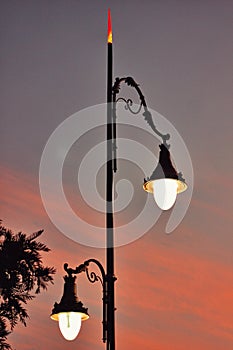 Lamp light street and sunset view