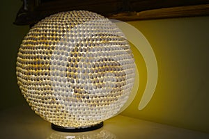 Lamp made of snail shells. snail shells