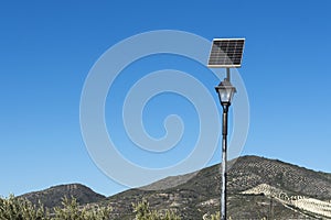 Lamp post with photovoltaic solar panel