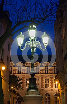 The lamp post on place de Furstenberg at night, Paris, France.