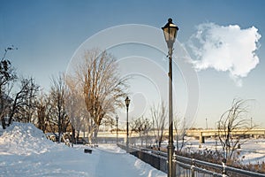 Lamp post on Promenade beside a river