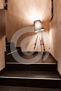 The lamp is between steps