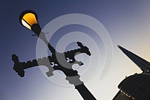 A lamp on Tower Bridge, London at dusk.