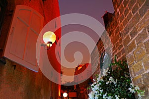 Lamp and view of the street of stone old city Jaffa in Tel Aviv, Israel