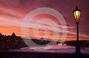 Lamp and Vltava river in the sunset