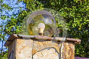 Lamp on the wall of the house fence