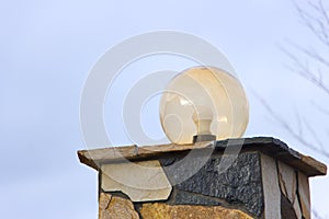 Lamp on the wall of the house fence