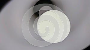 Lamp on a white ceiling, close-up of the lamp