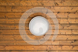 Lamp on wooden ceiling