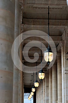 Lamposts Palais royal gardens public lights in the arcade at sunset Paris