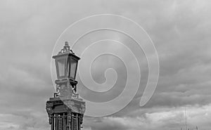 Lamppost against a cloudy sky