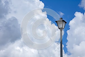 Lamppost Against Cloudy Sky With Copy Space