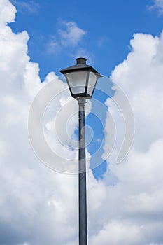 Lamppost Against Cloudy Sky Vertical