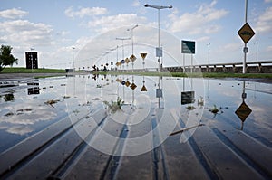 Lamppost alley reflected in water in Memorial park called Monumento las Victimas del Terrorismo de Estado photo