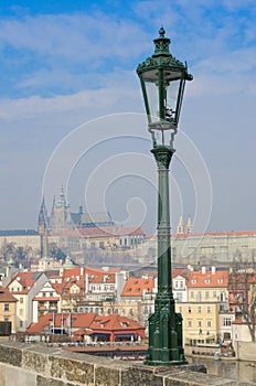 Lamppost on Charles Bridge, Prague castle view
