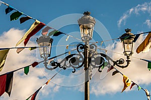 Lamppost decorated with flags for a party