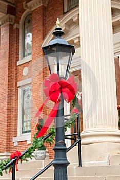Lamppost Decorated with Red Ribbon for Christmas