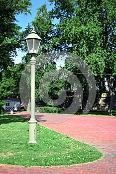 Lamppost on a lawn and footpath near Peter and Paul Fortress in Saint Petersburg