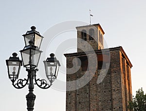 Lamppost and medieval tower in Piove di Sacco a town in the province of Padua located in Veneto (Italy) photo