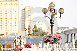 Lamppost with megaphones on city street