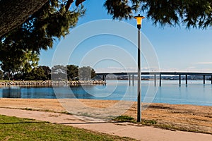 Lamppost on Mission Bay in San Diego with Bridge