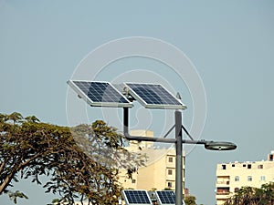 lamppost powered by clean energy of solar cells panel, or photovoltaic cell, an electronic device that converts the energy of