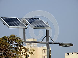 lamppost powered by clean energy of solar cells panel, or photovoltaic cell, an electronic device that converts the energy of