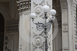 Lamppost on Risparmio Building, Bologna photo