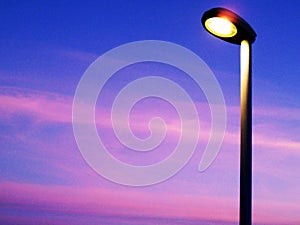 Lamppost at sunset in the beach sky of Cadiz capital, Andalusia. Spain