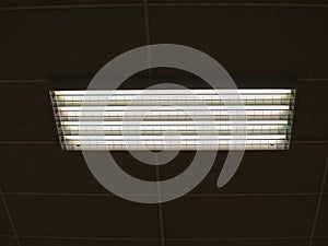 Lamps in ceiling in a stadium.   Ceiling with lighting panels