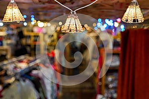 Lamps on the ceiling in the store on blurred background