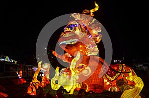Lamps from the Chinese Lantern Festival in honor of the New Year. Sculpture depicting a huge fire dragon with street lighting