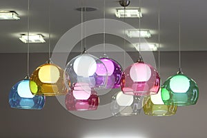 Lamps with colorful glass shades decorate the room. Vivid detail in the interior.