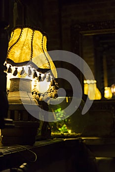 Retro lamp on an old piano and a fish bole photo