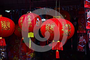 Lamps and red garments for use during Chinese New Year.
