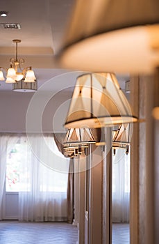 Lamps on walls near mirrors