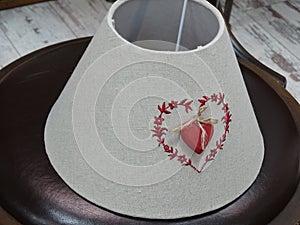 Lampshade made of fabric and embroidered with a heart