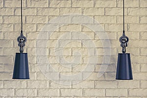 Lampshades on a brick wall background