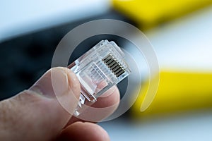 LAN ethernet rj45 connector in hand. Close up