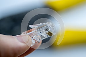 LAN ethernet rj45 connector in hand. Close up