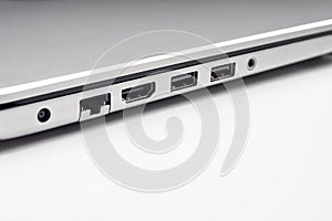 LAN , HDMI , firewire and usb ports of laptop computer on white