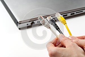 Lan wires cat5 cat6. hand holds wires with high speed internet access. Internet technologies of the future. connect to