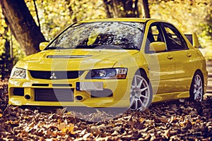 Lancer Evo 9 in the autumn road