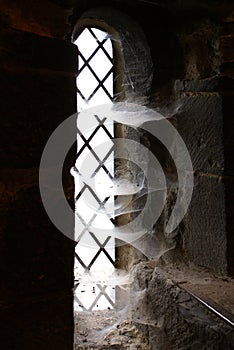 Lancet window with spider webs photo