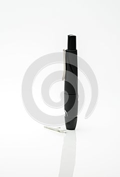 Lancing pen device on white background