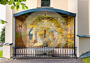 Golgotha polychromic artwork on St. John Baptist church in historic open-air museum town of Lanckorona in Lesser Poland