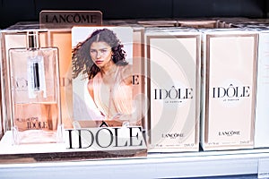 Lancome IDOLE perfume on the shop display for sale, fragrance created by LancÃÂ´me, Zendaya in background